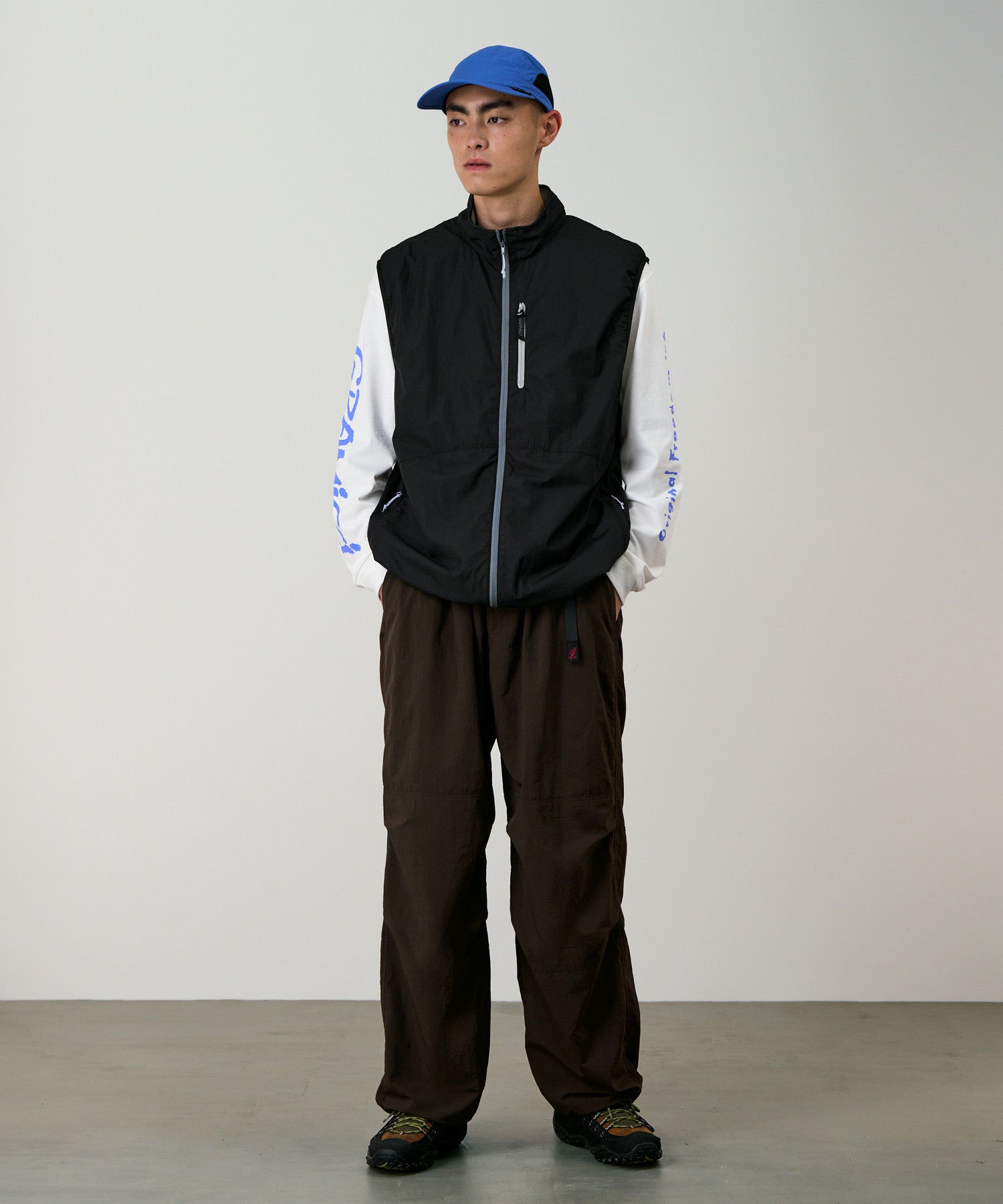 Flyweight Vest Black model front view outdoor vest layering fit