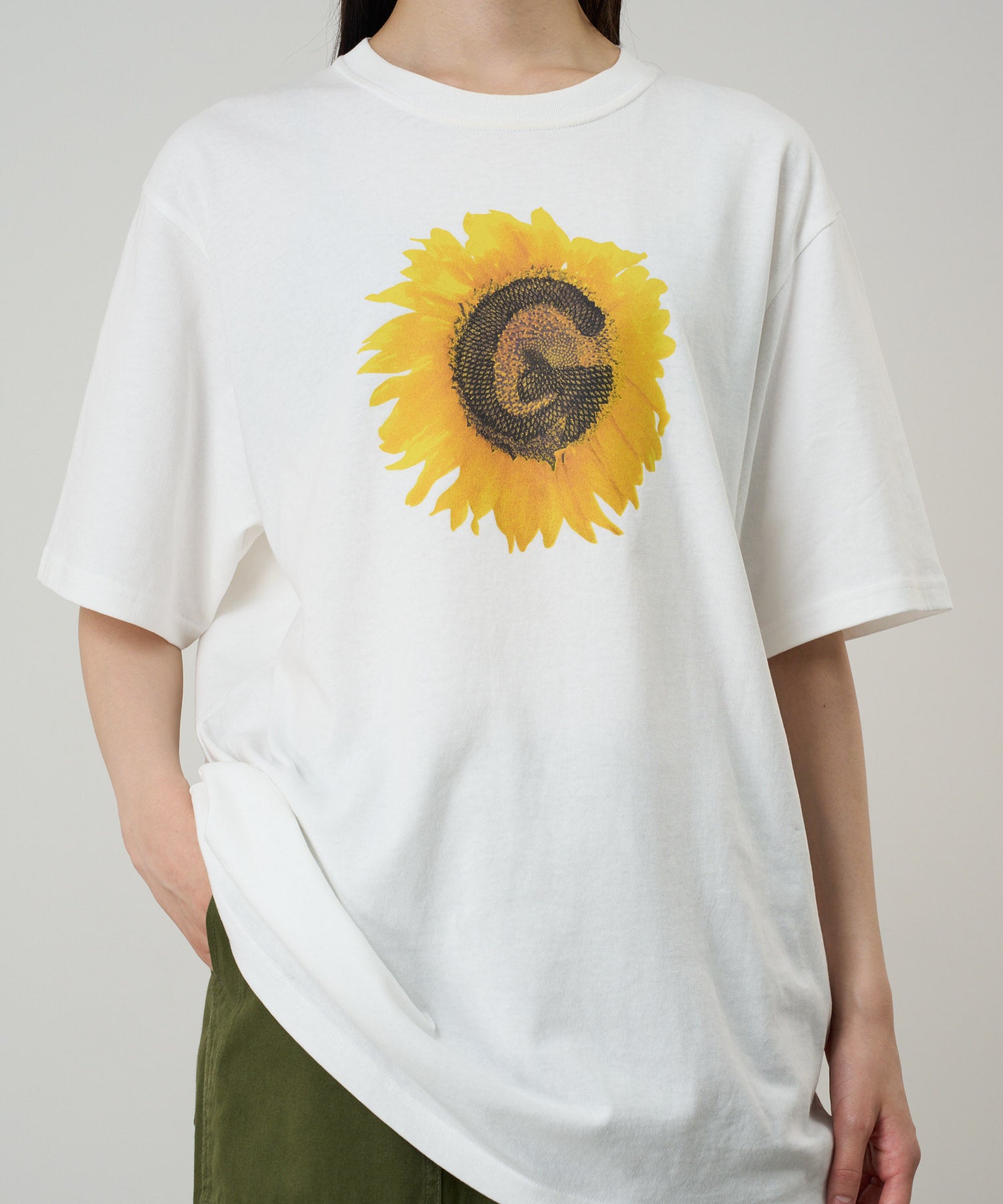 Woman wearing Gramicci G-Flower Tee White eco cotton graphic T-shirt