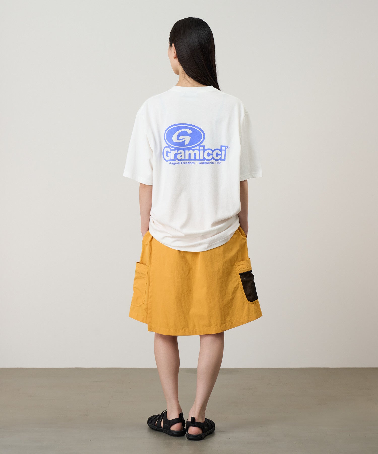 Model wearing Gramicci ’82 Tee White eco cotton graphic T-shirt streetwear fit