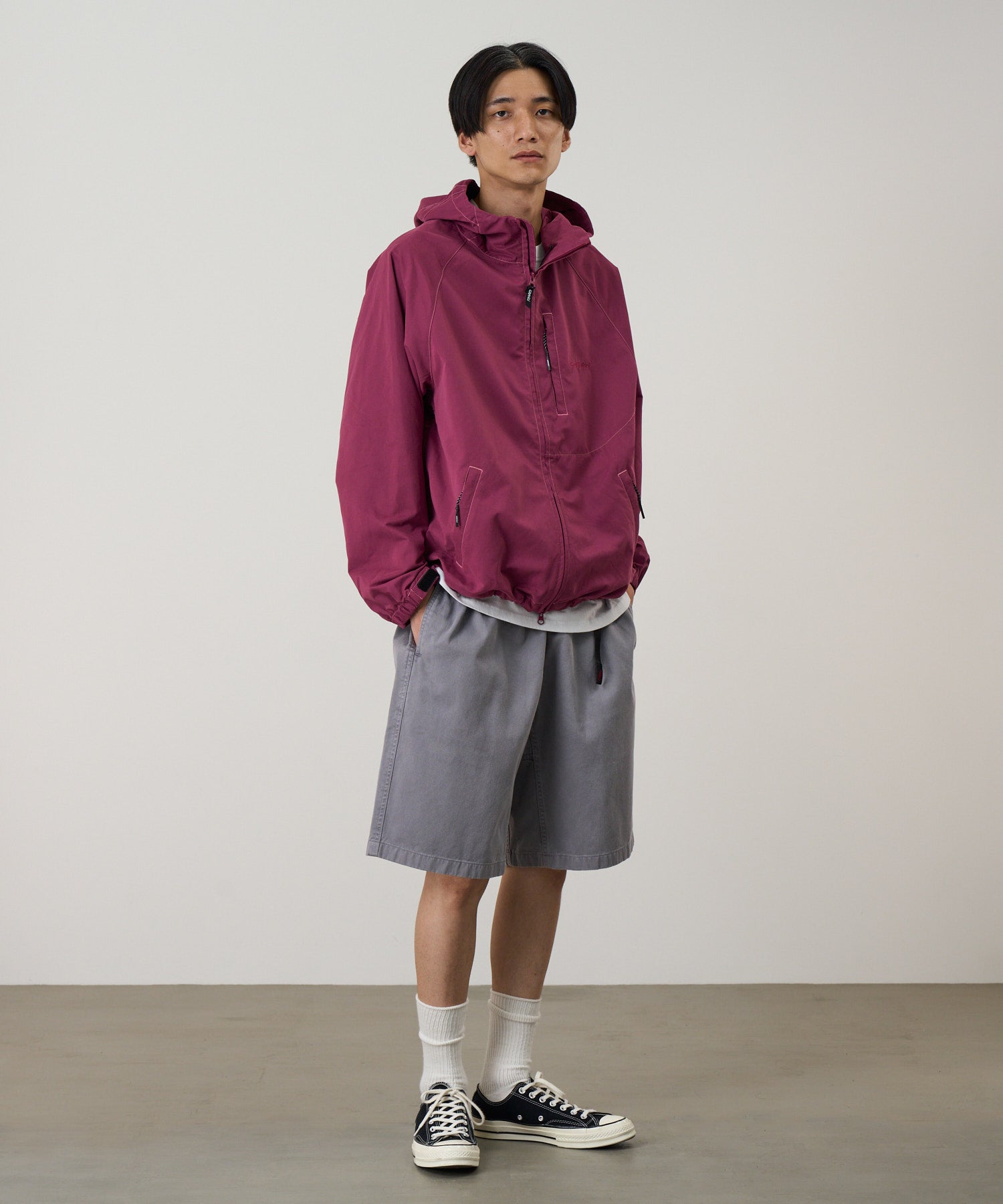 Gramicci burgundy pants on body model showing relaxed fit and comfort