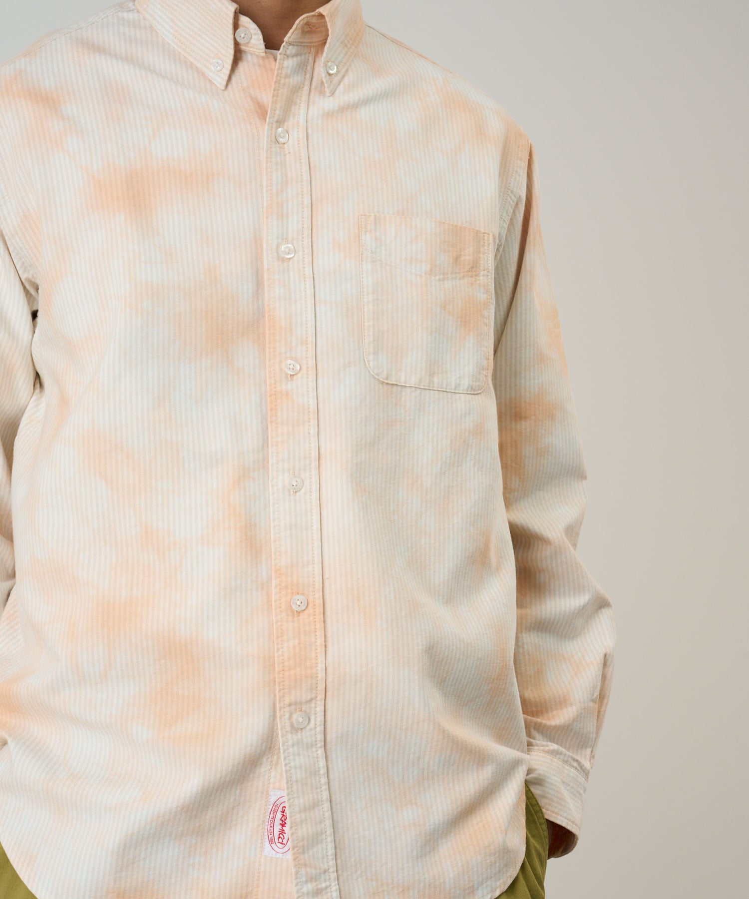 Model wearing Gramicci checkered ombre shirt mustard stripe relaxed fit casual oxford shirt full view