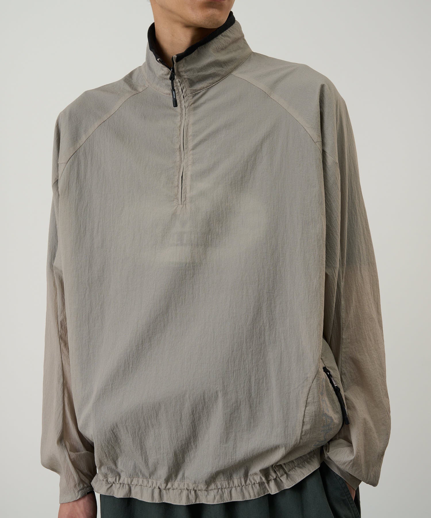 Gramicci concrete jacket on model showing relaxed fit and styling view
