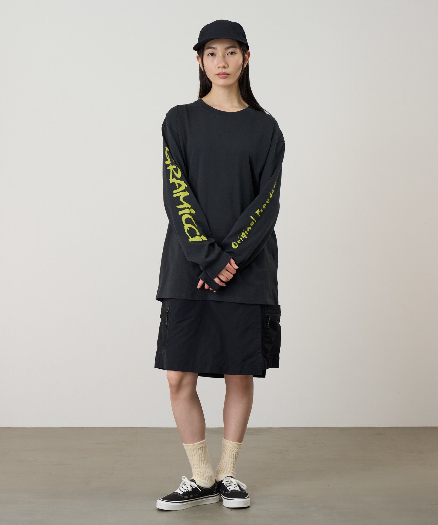 Front view of a model wearing Gramicci Freedom L/S Tee Vintage Black made from eco cotton with a relaxed fit for everyday wear.