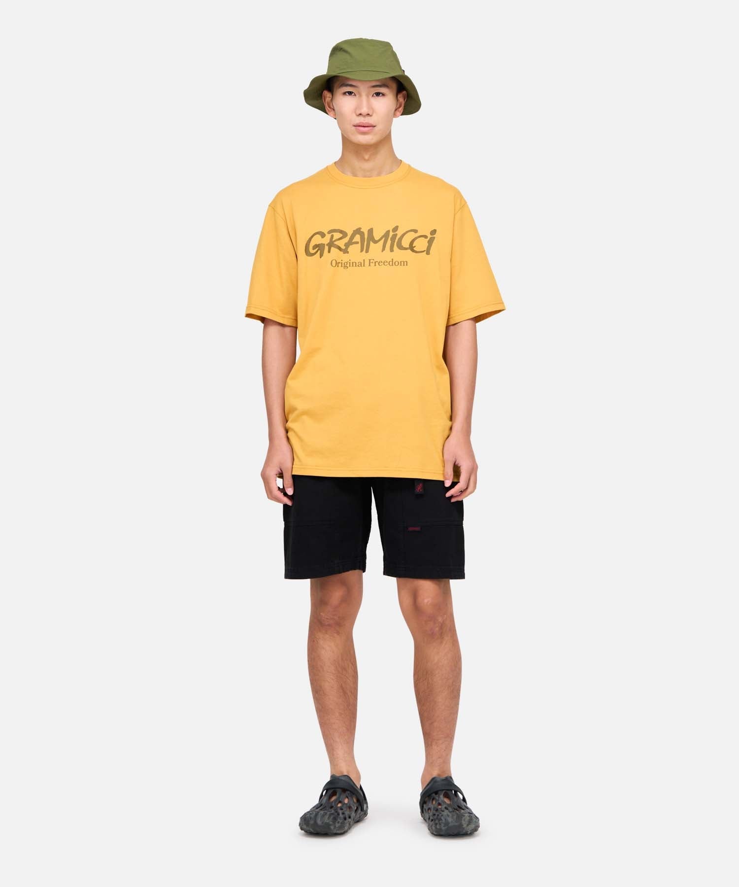 Model wearing Gramicci Gadget Shorts Black relaxed fit outdoor shorts front view lifestyle