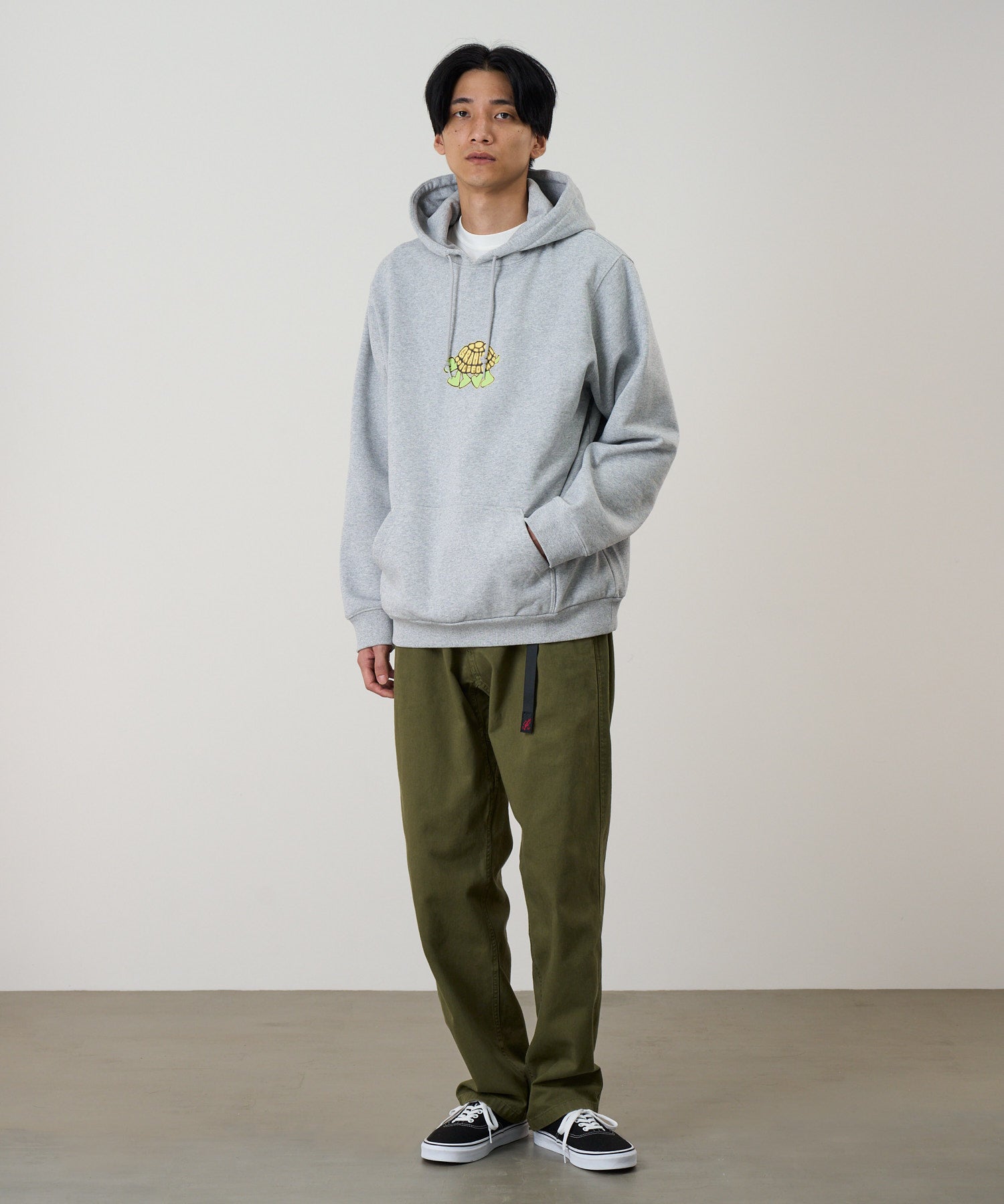 Gramicci hoodie heather grey on body front fit showing relaxed everyday comfort