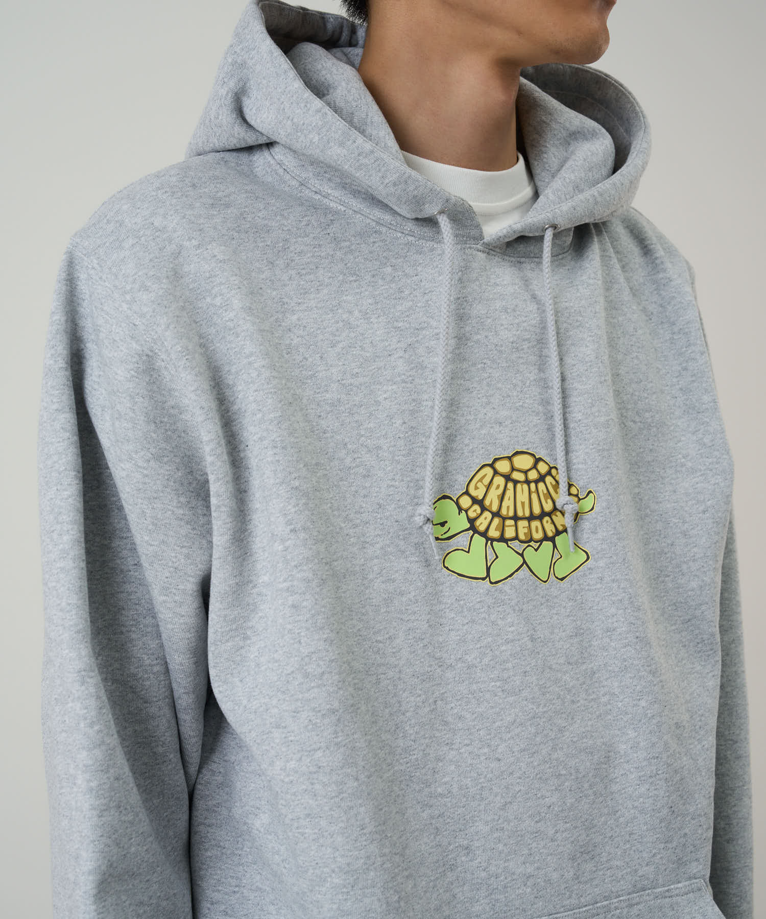 Gramicci hoodie heather grey on body fit showing relaxed comfort and movement