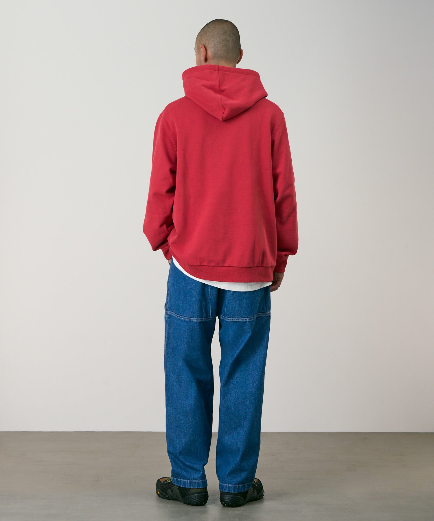 Gramicci denim EQT pants light wash on body angle showing relaxed everyday comfort