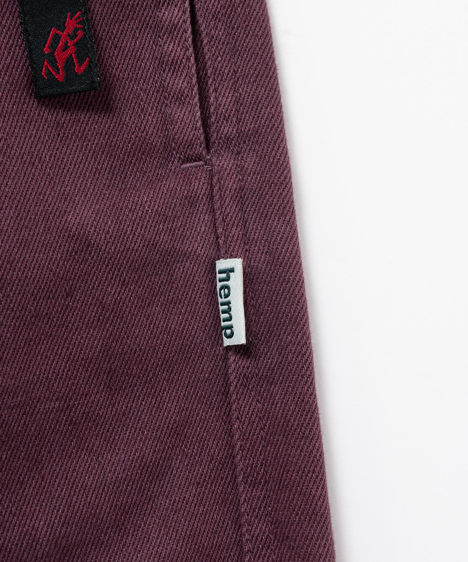 Close-up detail of Gramicci Nylon Explorer Cargo Shorts Deep Grape showing utility cargo pocket and zipper design