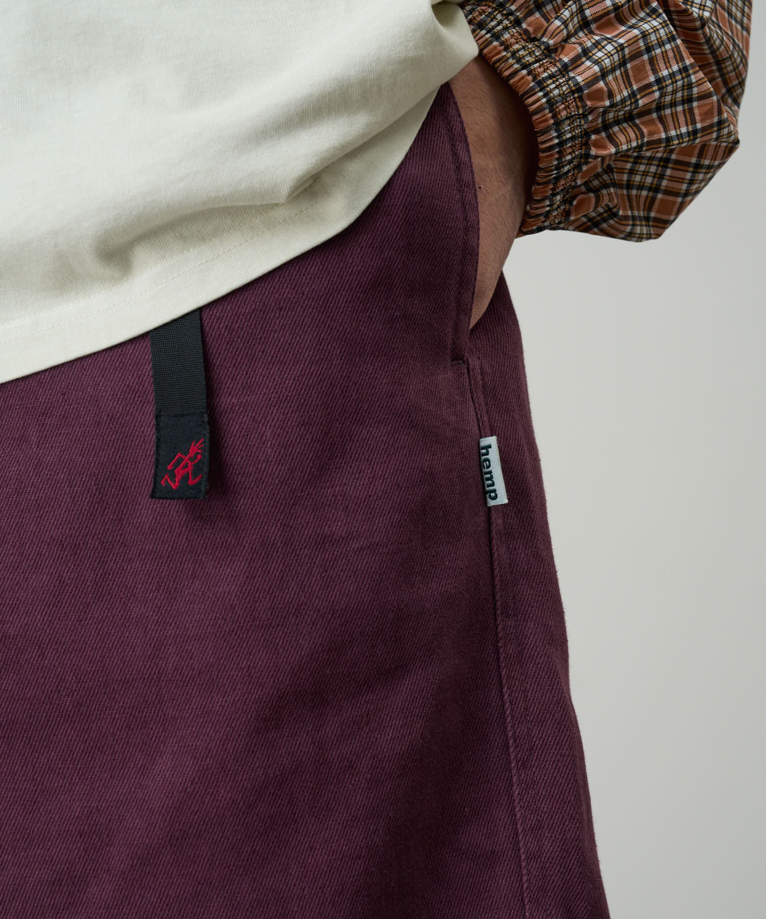 Model wearing Gramicci Nylon Explorer Cargo Shorts Deep Grape outdoor lifestyle full body relaxed fit view