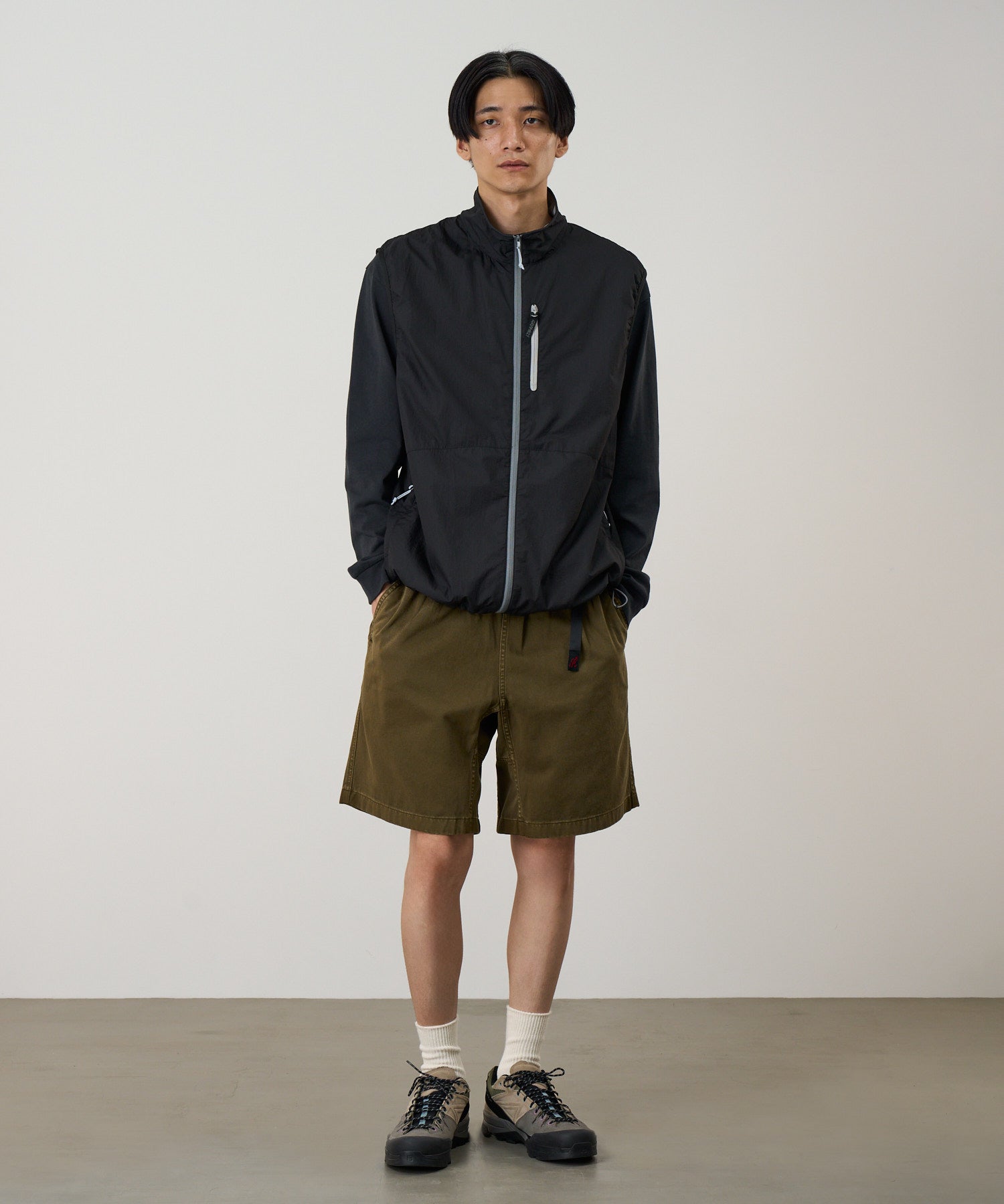 Model wearing Gramicci P123 pigment pants in bark color side view