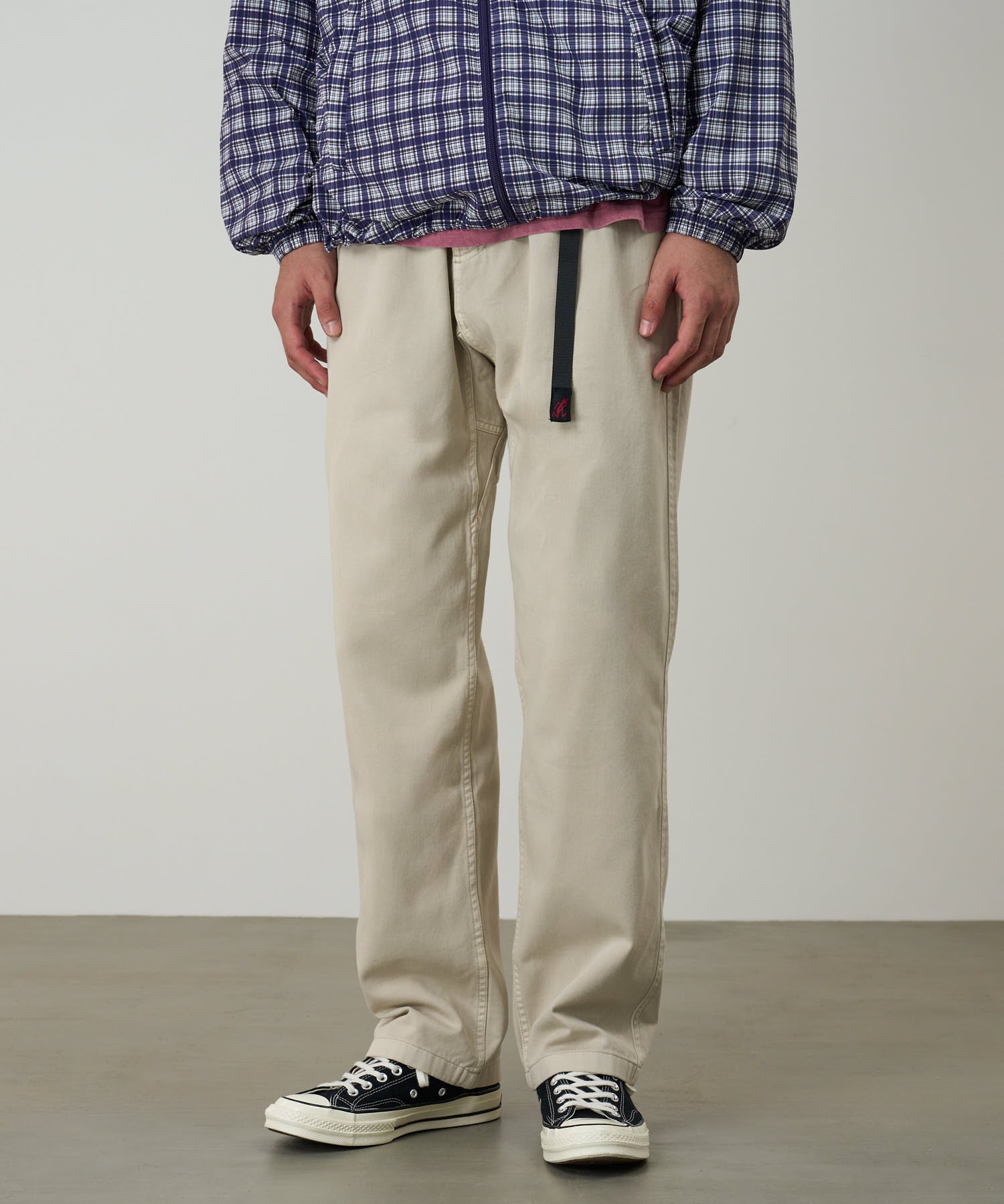 Model wearing Gramicci Pant Sand Pigment relaxed fit eco-cotton pants lifestyle shot