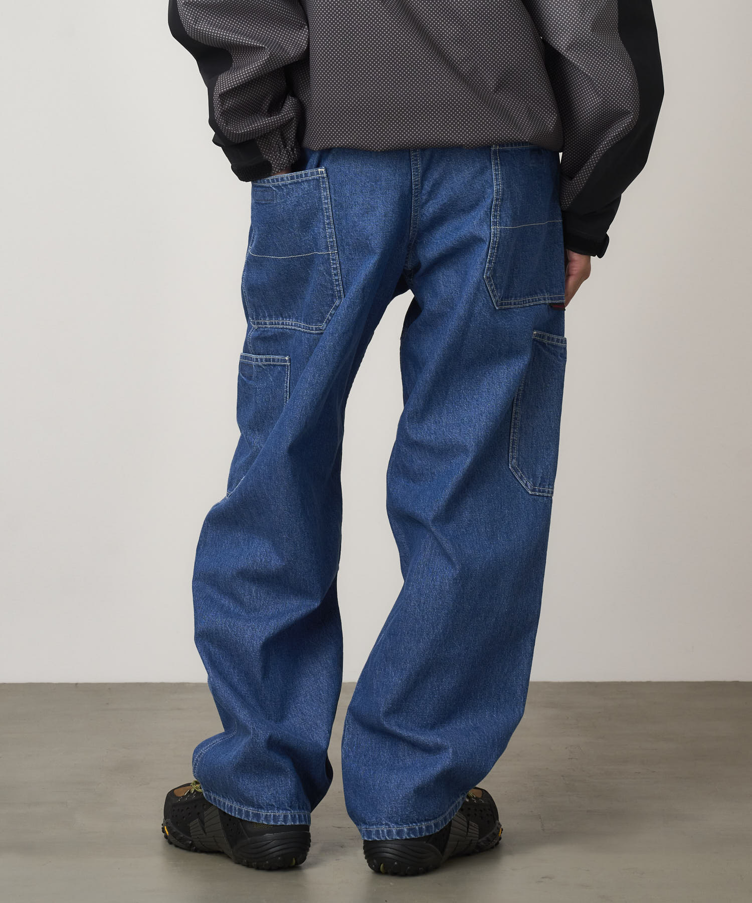 Close-up detail of Gramicci Rock Slide Denim Pant Light Wash showing cargo pockets, 11oz eco cotton denim and durable everyday construction.