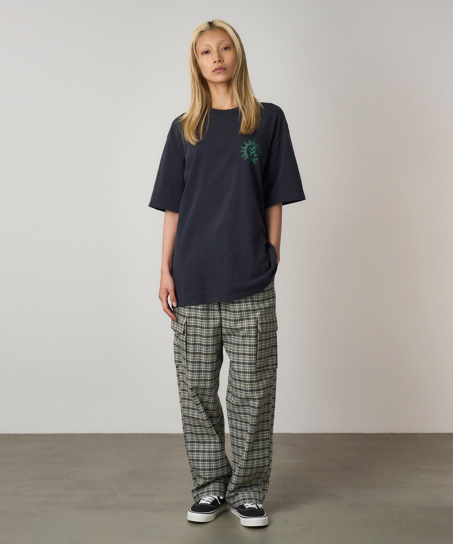 Model wearing Gramicci Sun Tee in Navy Pigment made from dry-touch eco cotton with a relaxed fit