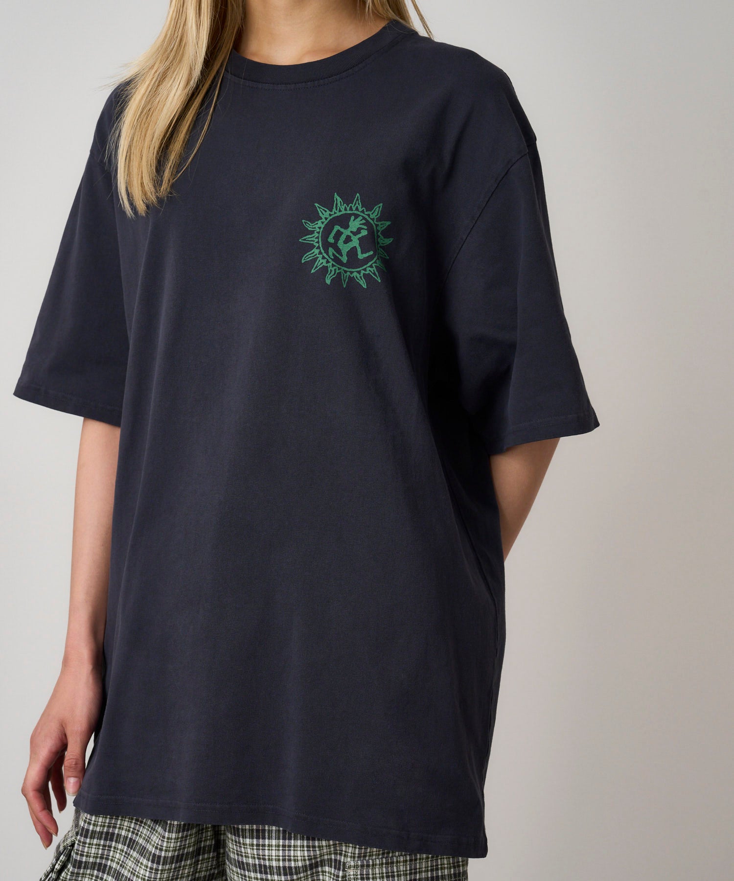 Side and back view of model wearing Gramicci Sun Tee in Navy Pigment with a relaxed fit and pigment-dyed eco cotton fabric