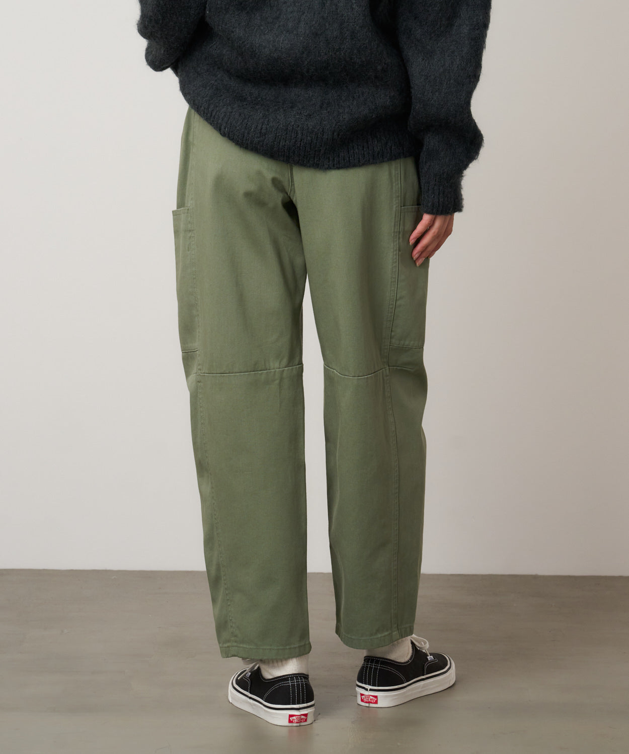 Close-up of model wearing Women's Gramicci Voyager Pant Sage in 100% eco cotton washed twill
