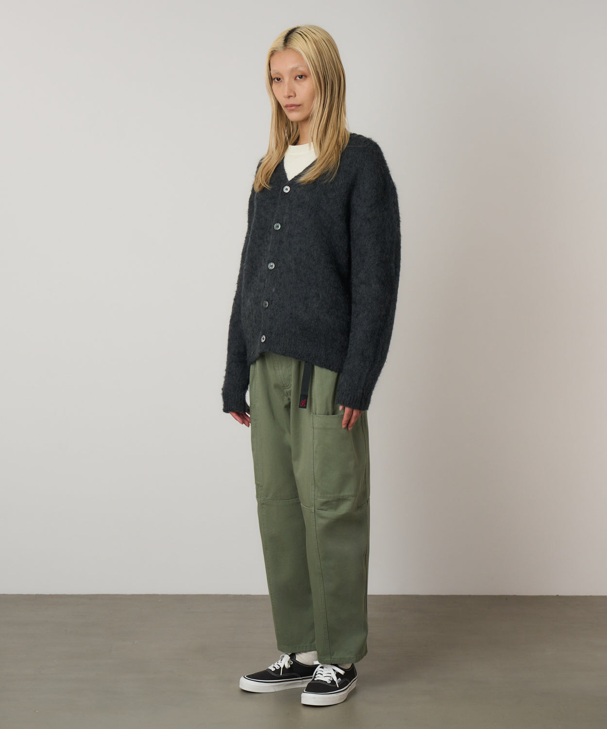 Side view of model wearing Women's Gramicci Voyager Pant Sage in 100% eco cotton washed twill