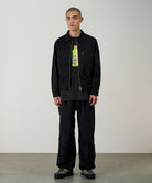 Model wearing Gramicci black nylon trek pants standing outdoor
