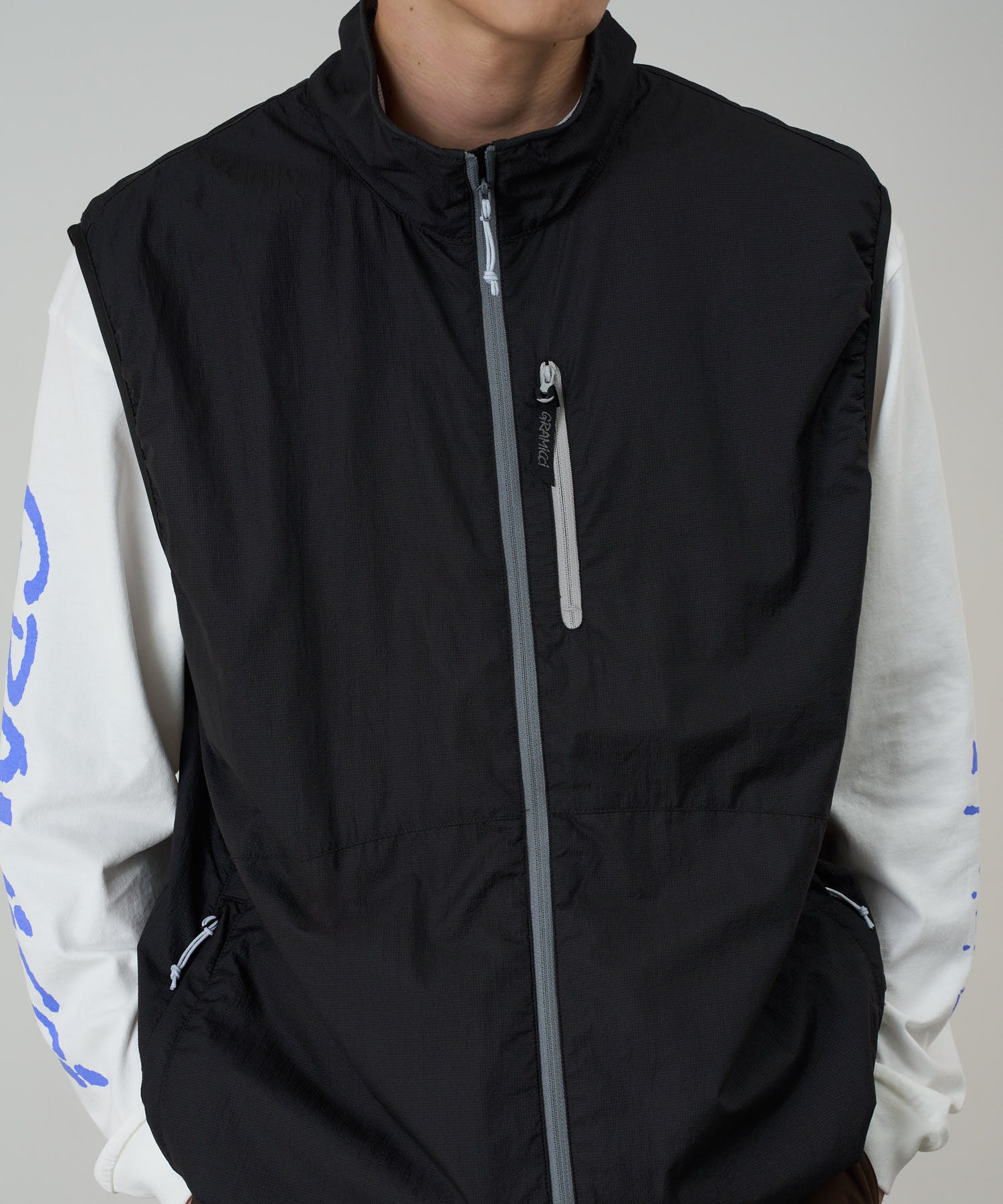 Flyweight Vest Black model side view outdoor vest layering fit