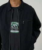 Gramicci black workwear pants on body angle showing comfort and everyday movement