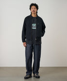 Gramicci black workwear pants on body fit showing relaxed everyday comfort and movement
