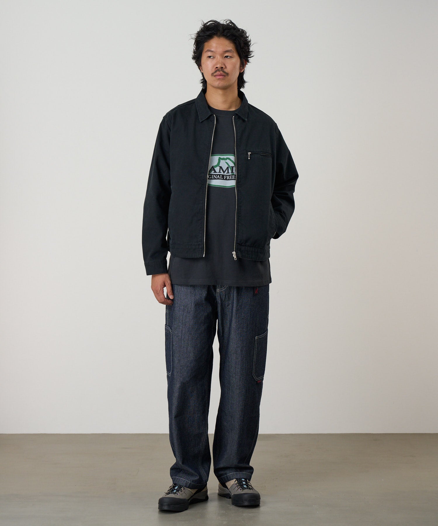 Gramicci black workwear pants on body fit showing relaxed everyday comfort and movement