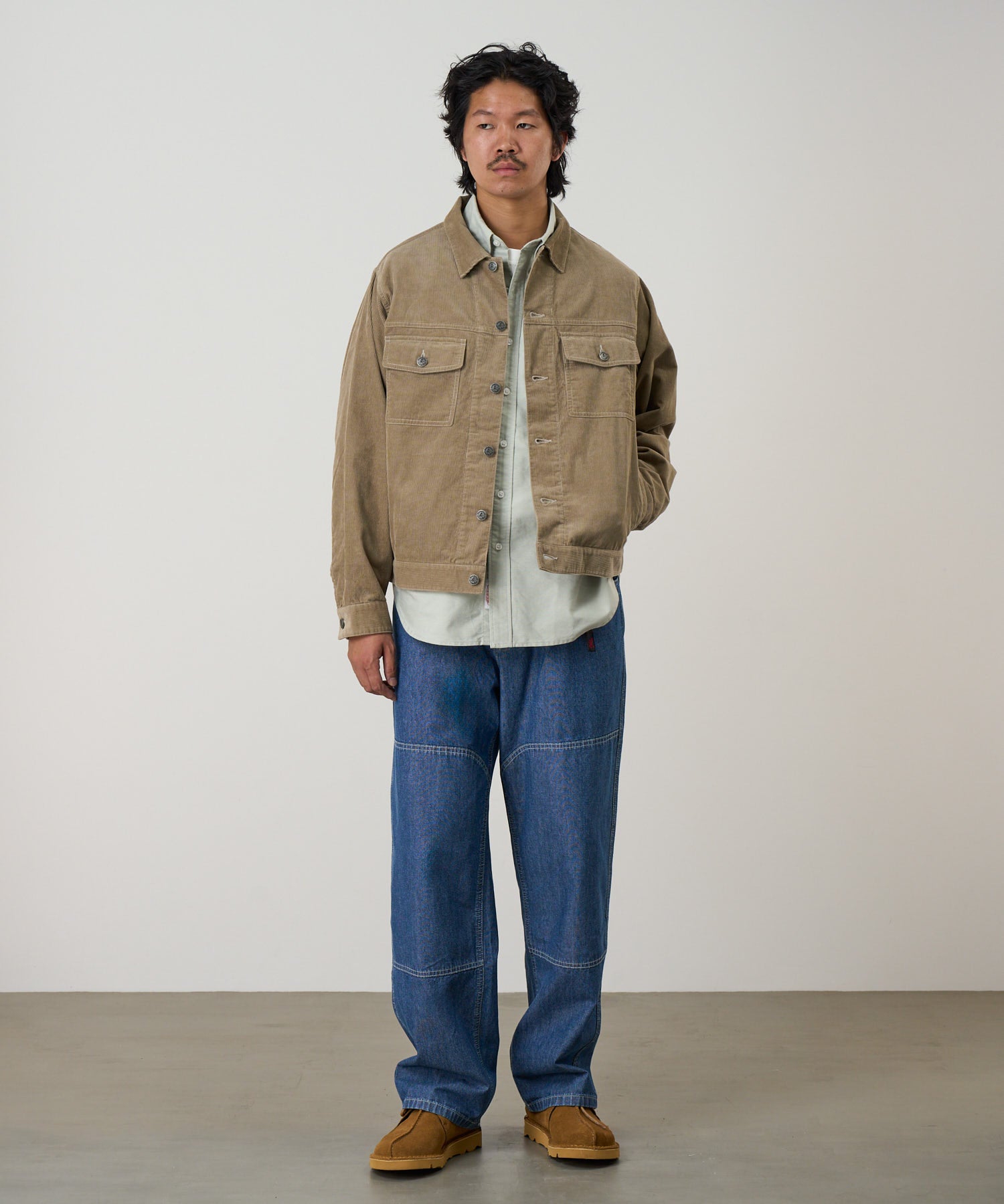 Gramicci workwear pants blue on body fit showing relaxed comfort and movement