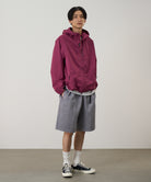 Gramicci burgundy pants on body model showing relaxed fit and comfort