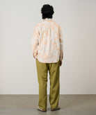 Model wearing Gramicci checkered ombre shirt mustard stripe relaxed fit oxford shirt back view casual style