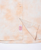 Close-up of Gramicci checkered ombre shirt mustard stripe showing breathable fabric texture and stitching detail