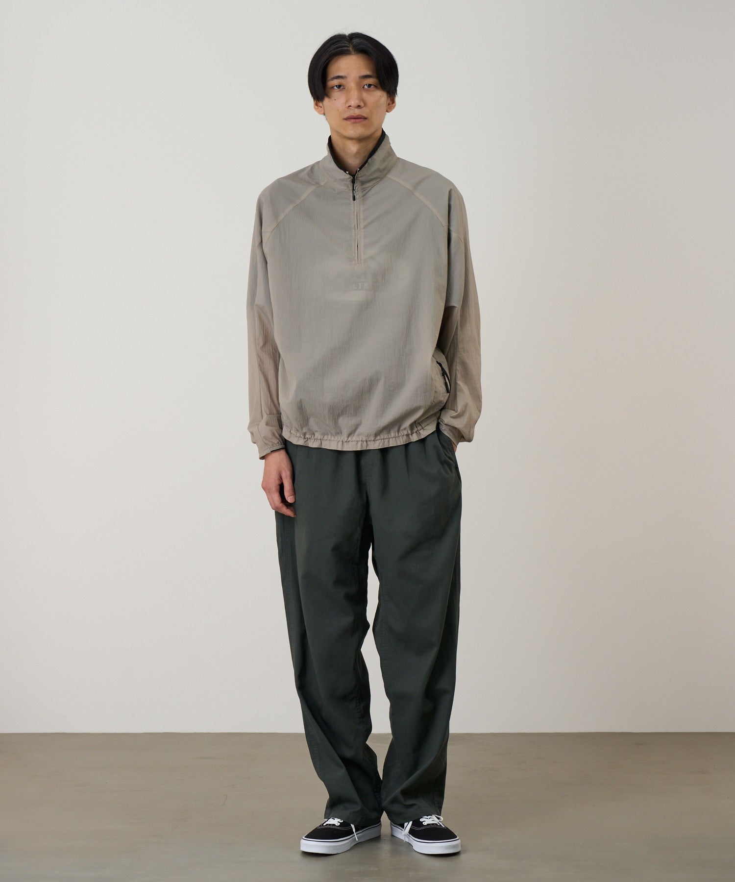 Gramicci concrete jacket worn on model showing front relaxed fit and styling