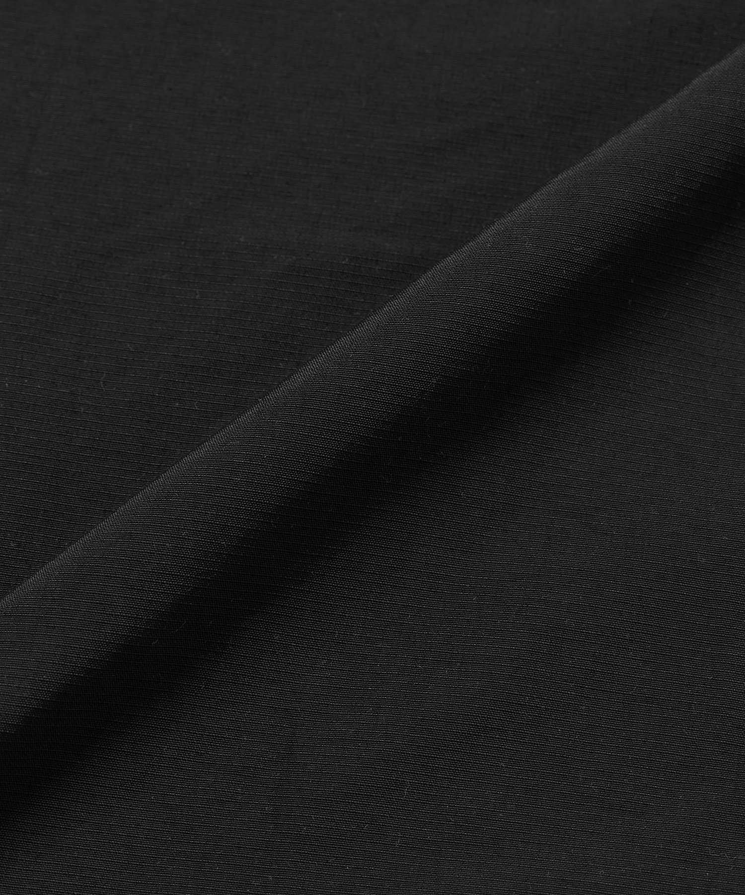 Gramicci Convertible Cargo Skirt Black flat lay in eco cotton with utility cargo pockets, adjustable design and everyday versatility.