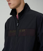 Side view of Gramicci Guide Jacket Black featuring lightweight water-repellent fabric, UV protection and a comfortable fit for everyday wear.