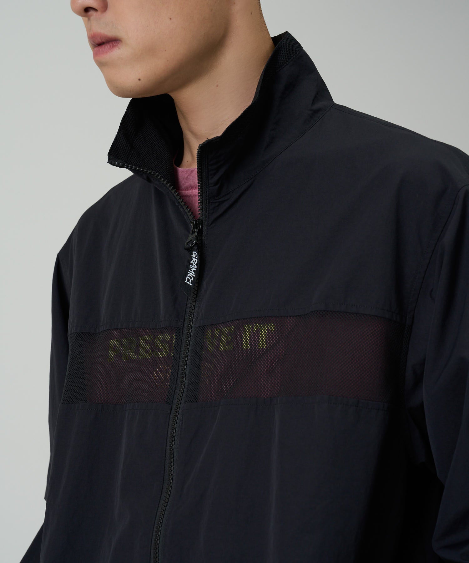 Side view of Gramicci Guide Jacket Black featuring lightweight water-repellent fabric, UV protection and a comfortable fit for everyday wear.