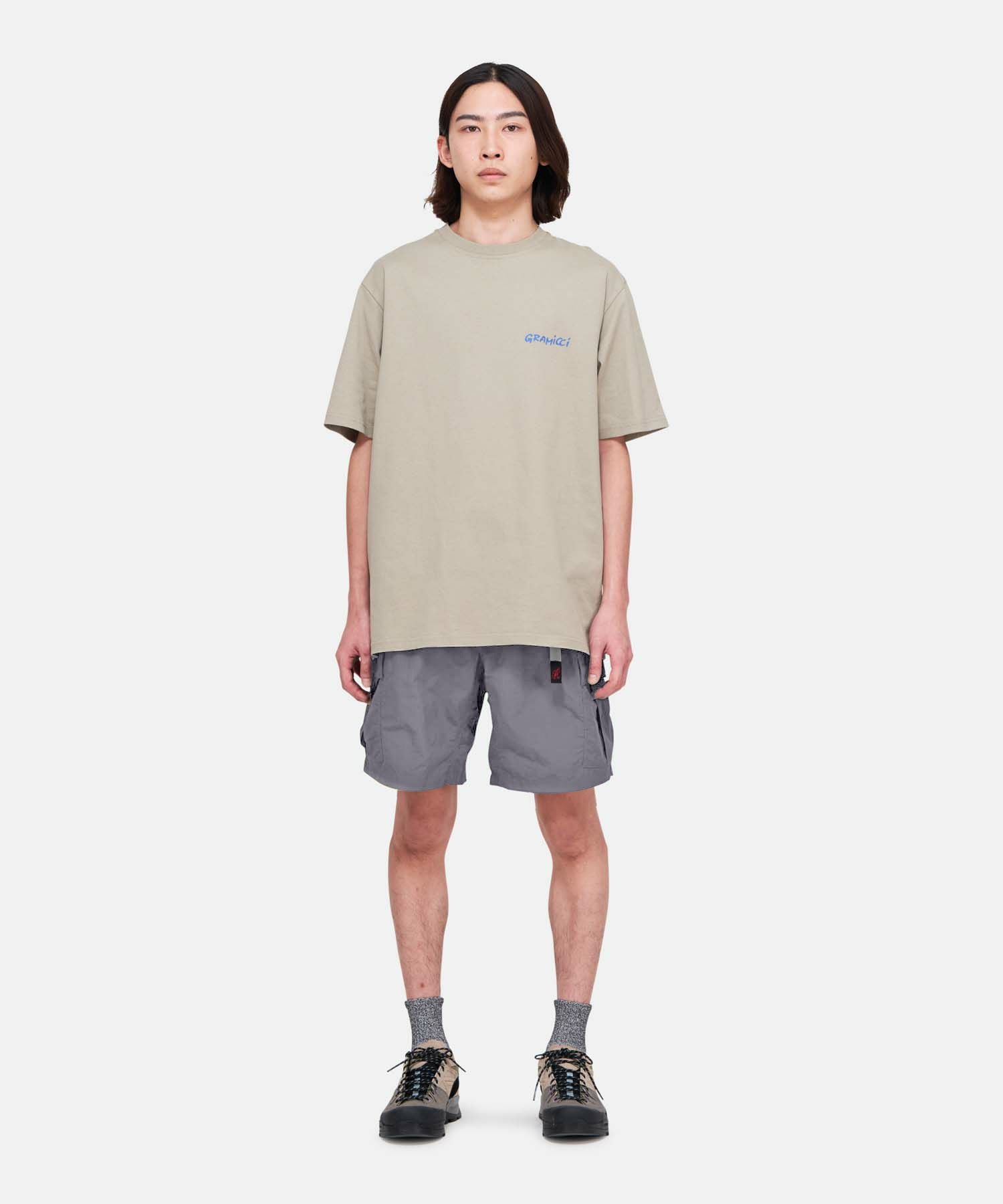 Model wearing Gramicci Nylon Explorer Cargo Shorts Grey relaxed fit outdoor shorts front lifestyle view