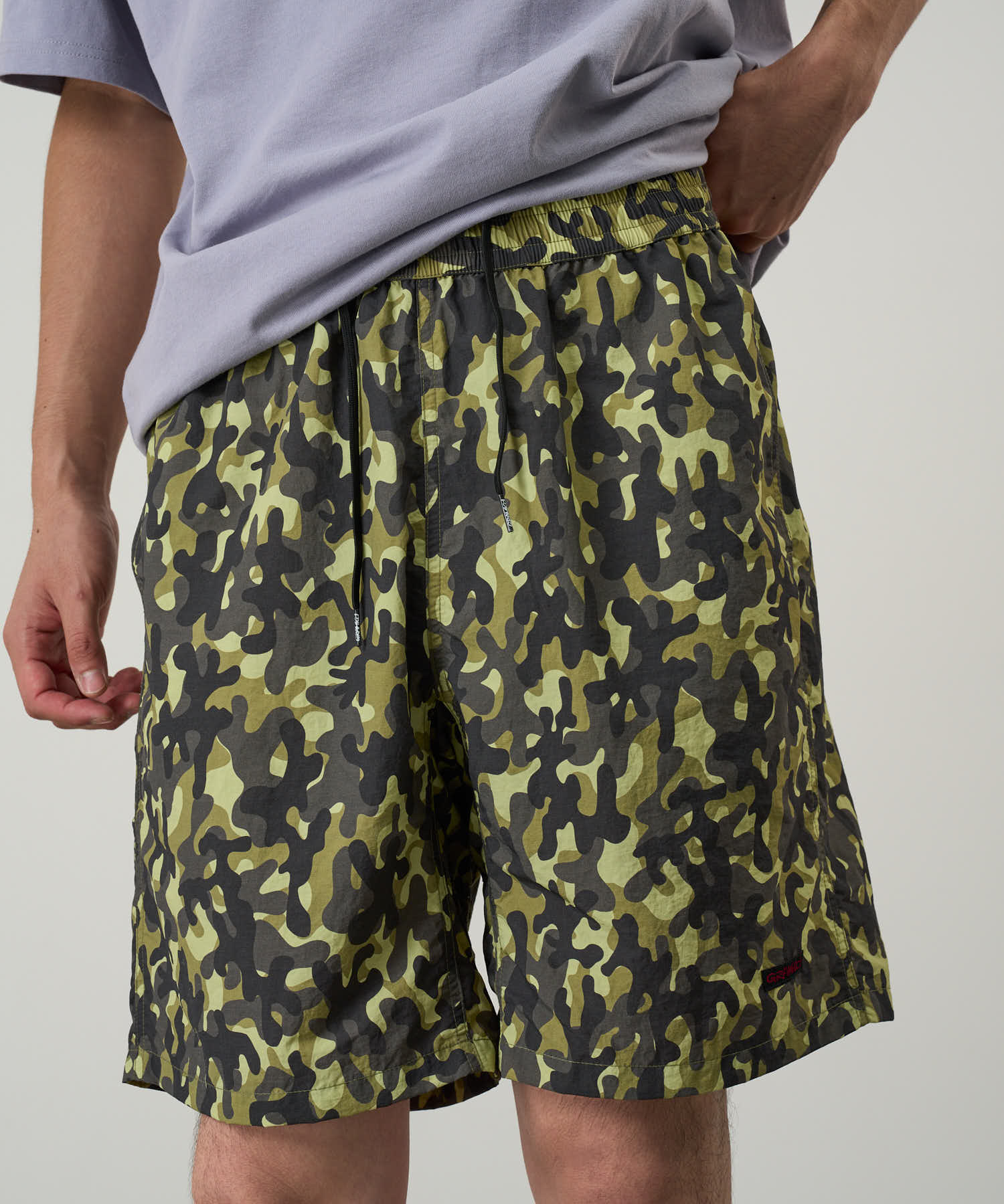 Gramicci Nylon Reef Short Olive Camo on model – quick-dry water-resistant shorts with relaxed fit for beach and outdoor lifestyle