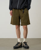 Model wearing Gramicci P123 pigment pants in bark color relaxed fit
