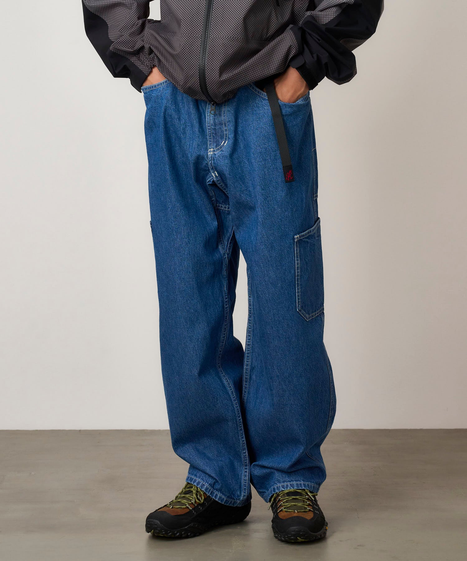 Close-up of Gramicci Rock Slide Denim Pant Light Wash showing 11oz eco cotton denim, cargo pockets and durable outdoor-inspired design.