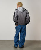 Side view of model wearing Gramicci Rock Slide Denim Pant Light Wash in 11oz eco cotton denim with cargo pockets and relaxed fit.