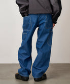 Close-up detail of Gramicci Rock Slide Denim Pant Light Wash showing cargo pockets, 11oz eco cotton denim and durable everyday construction.