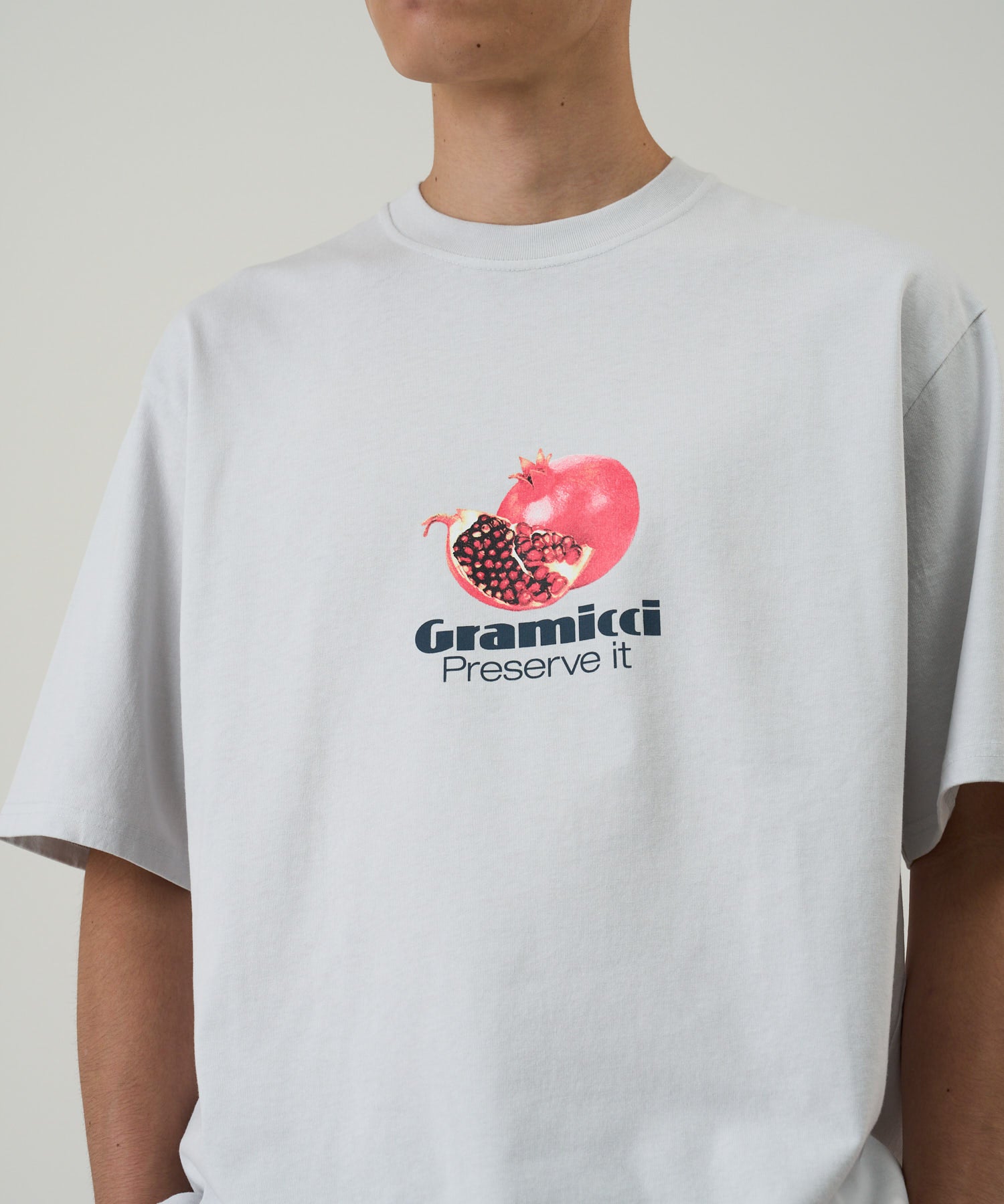 Gramicci Smoke Pomegranate graphic tee on model side view organic cotton relaxed fit