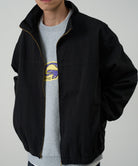 Model wearing Gramicci Twill Around Jacket Black from side view