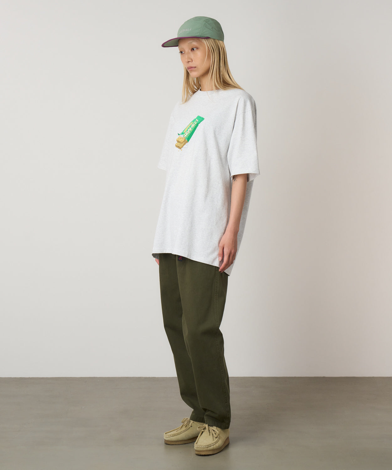 Granola Tee Heather Ash eco cotton graphic t-shirt on model side view relaxed fit casual wear