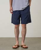 Model wearing Gramicci Nylon Reef Short British Navy quick-dry swim shorts