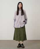 Model wearing Gramicci Nylon Utility Skirt Olive lightweight water-resistant utility skirt lifestyle fit