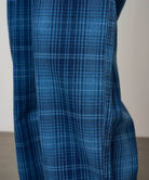Close-up detail of Gramicci O.G. denim plaid pant indigo checkered showing fabric texture and stitching