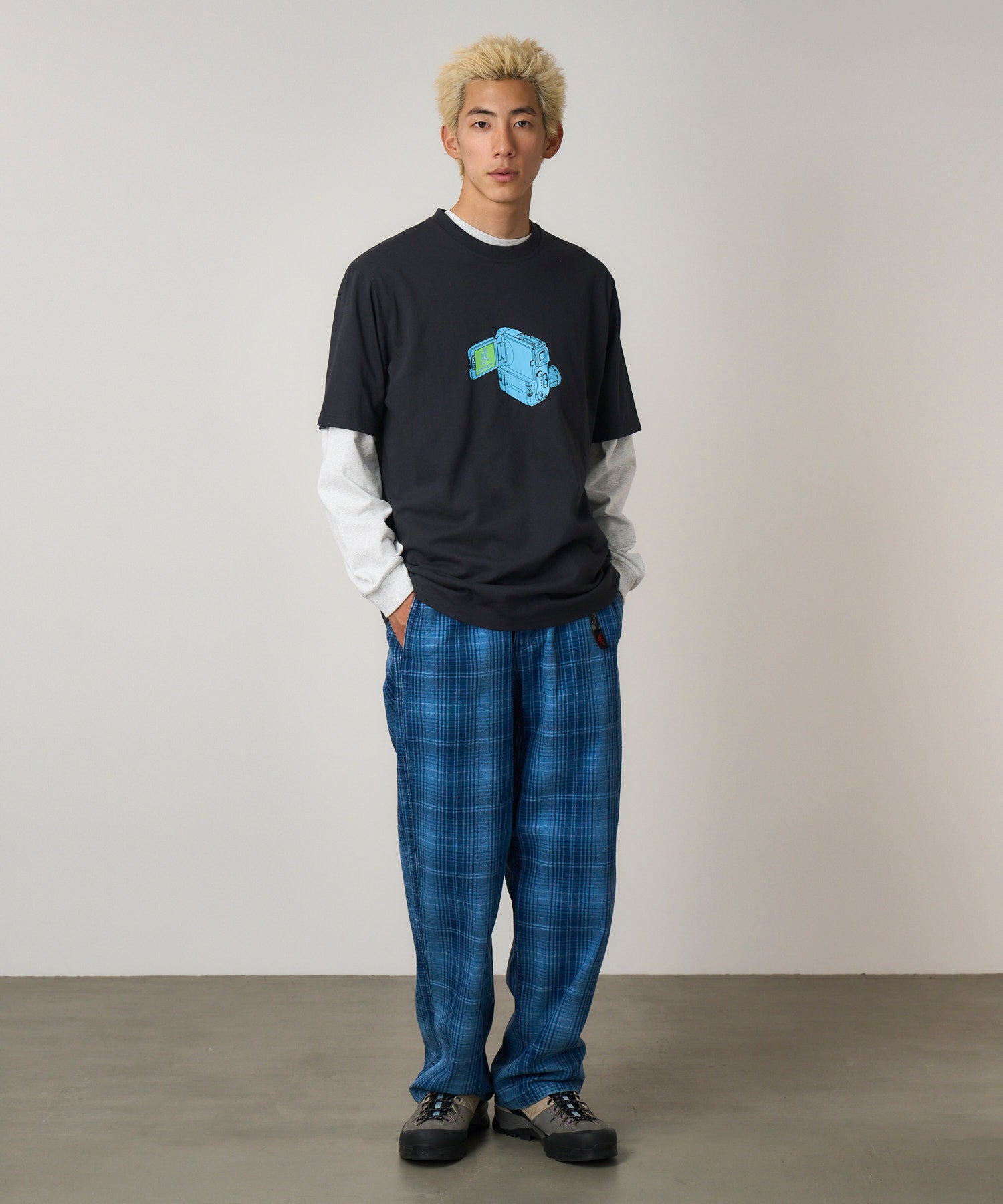 Model wearing Gramicci O.G. denim plaid pant indigo checkered relaxed fit trousers front view