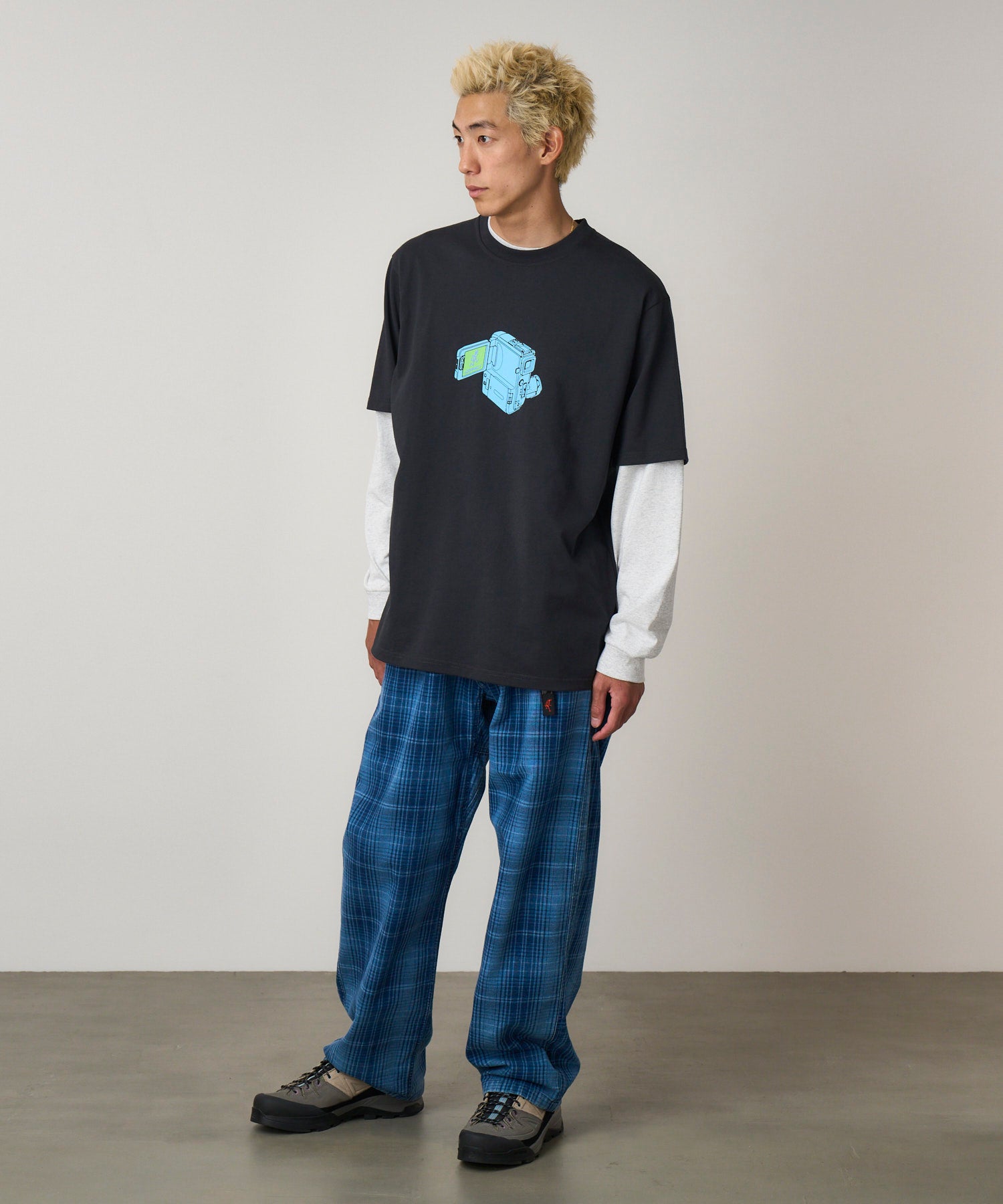 Model wearing Gramicci O.G. denim plaid pant indigo checkered relaxed fit side view straight leg trousers