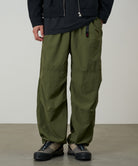 Gramicci olive nylon trek pants worn fit and movement detail
