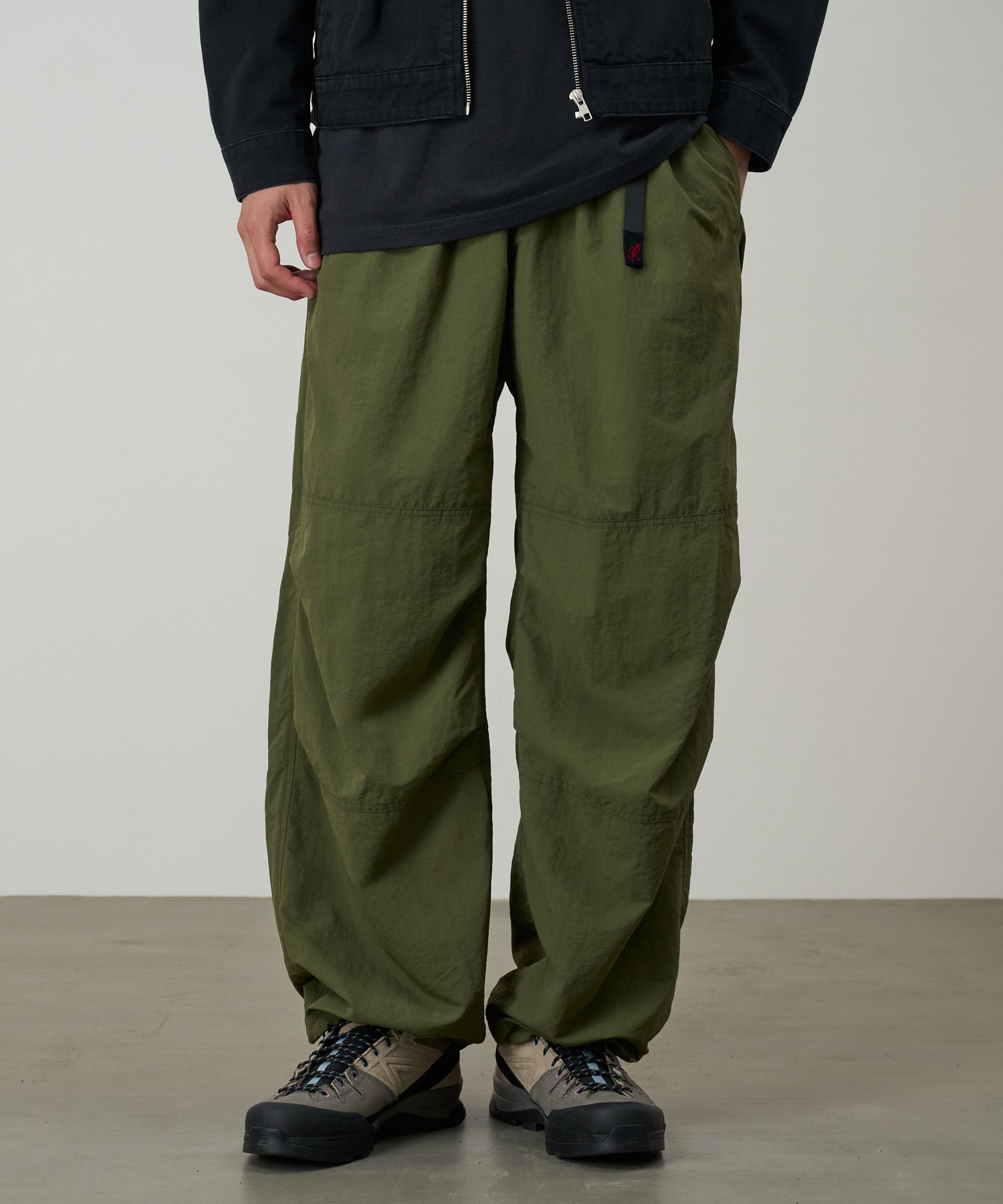 Gramicci olive nylon trek pants worn fit and movement detail