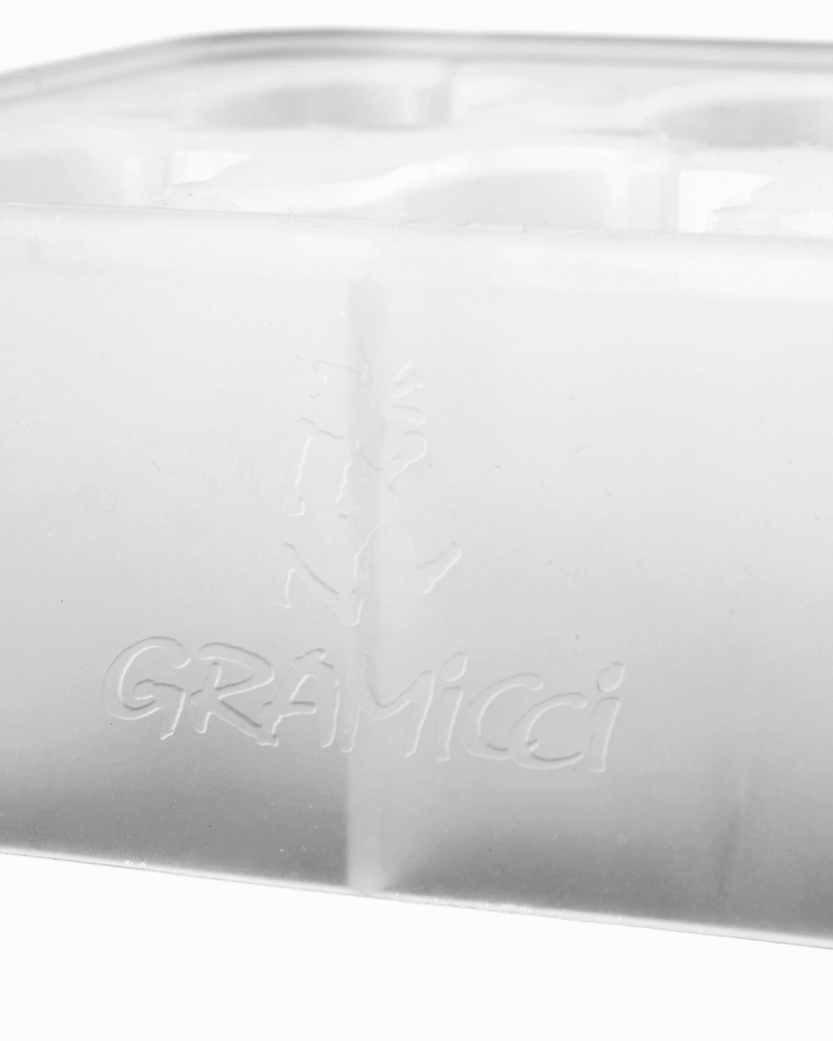 Angled view of Running Man Ice Cube Tray in glacier made from 100% food-grade silicone showing flexible mold design for creating shaped ice cubes